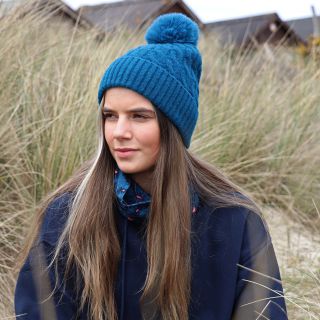 50% recycled teal cable knit and faux fur bobble hat by Peace of Mind